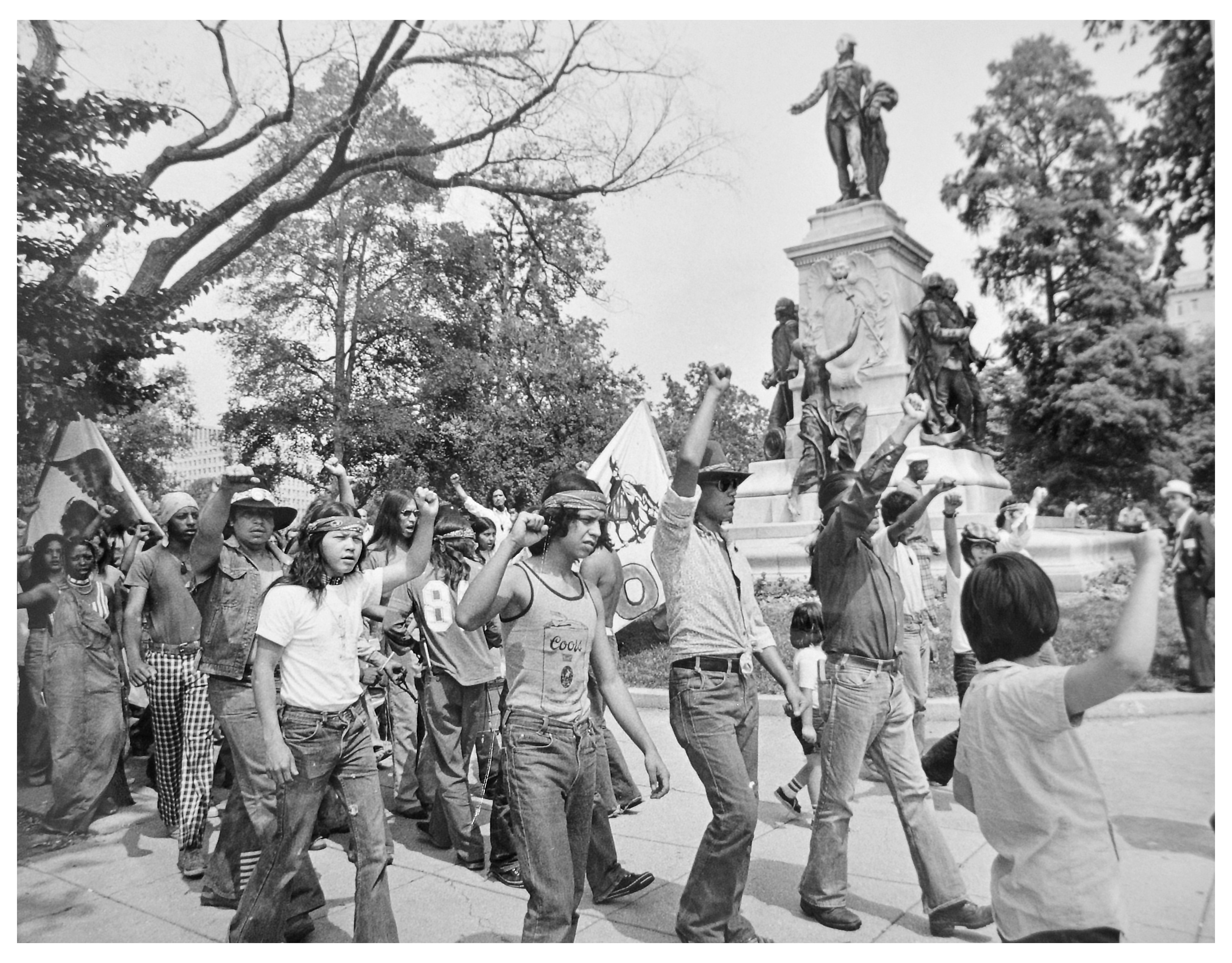 Black and white photograph showing AIM protserters marching during the Trail of Self Determination