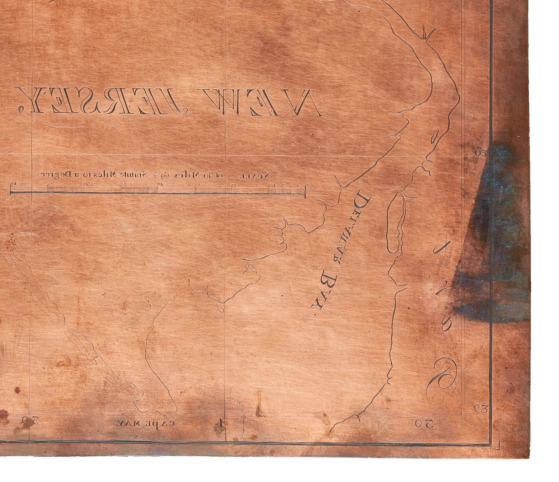 Engraved copper plate showing how text reads backwards.